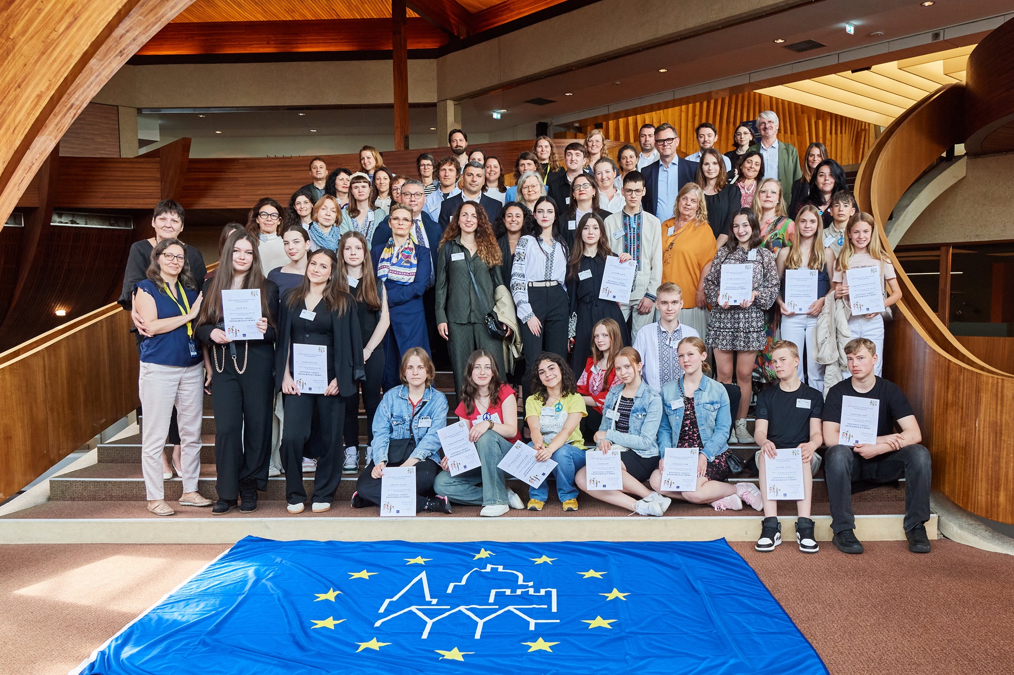 young european heritage makers and national coordinators of the european heritage days group photo on the stairs of the Council of Europe