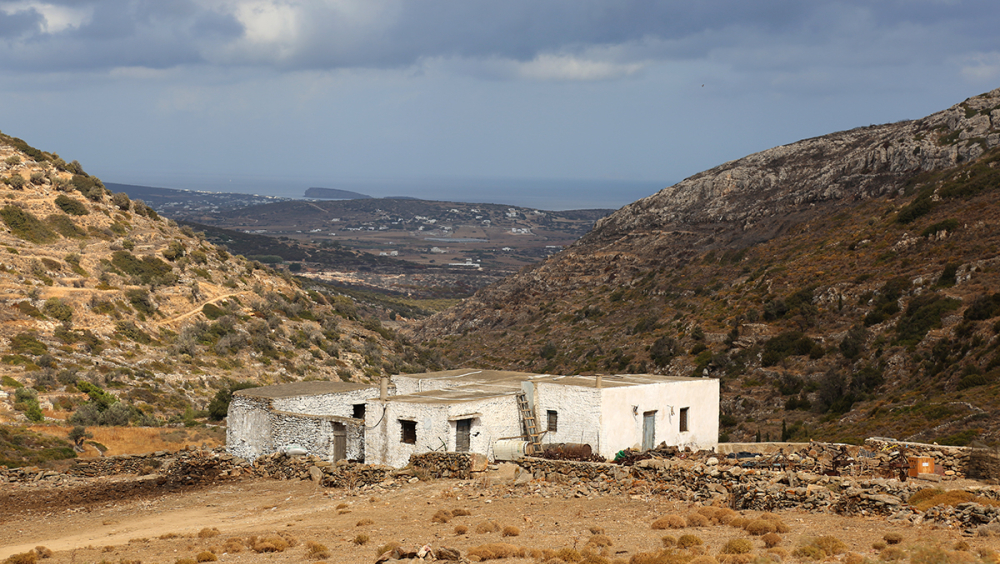 Paros island landscape and exterior view of a traditional rural house.