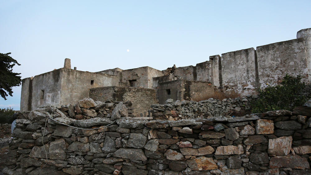 Exterior view of stone-built complex including crop storage rooms, barns and a wood-fired oven unit.