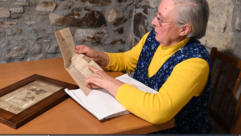 An elderly lady telling the story of her family