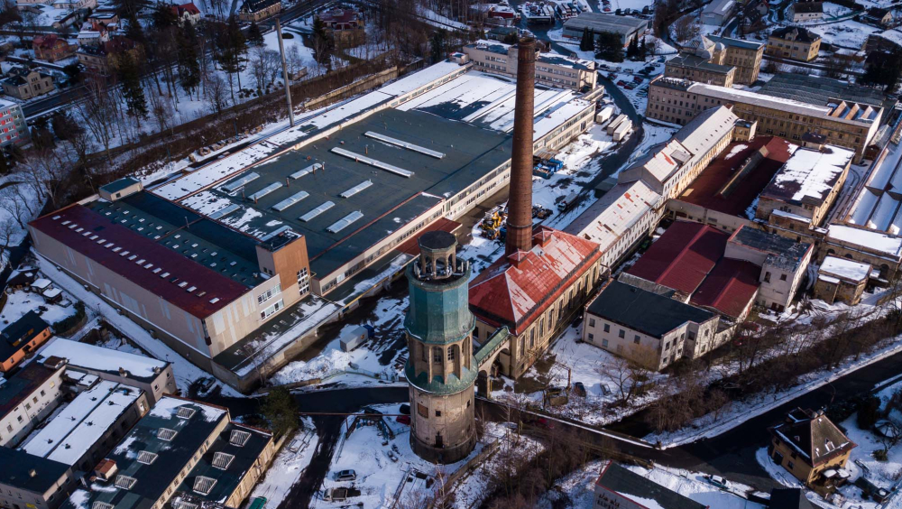 In the heart of the village lies a vast area, the center of which is the tower, which we are trying to save. You are watching the former building of the world-famous carpet factory, which made the village as famous as Ferdinand Porsche, who was born just a short distance from the tower.