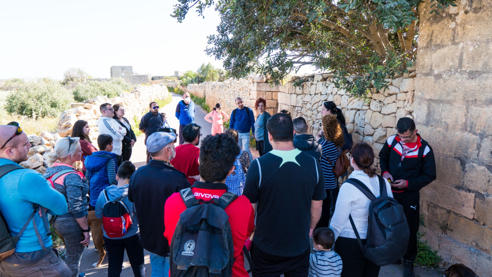 A shot from one the many walks organised by SKALI Gudja, where attendees are being given information on what they're about to see