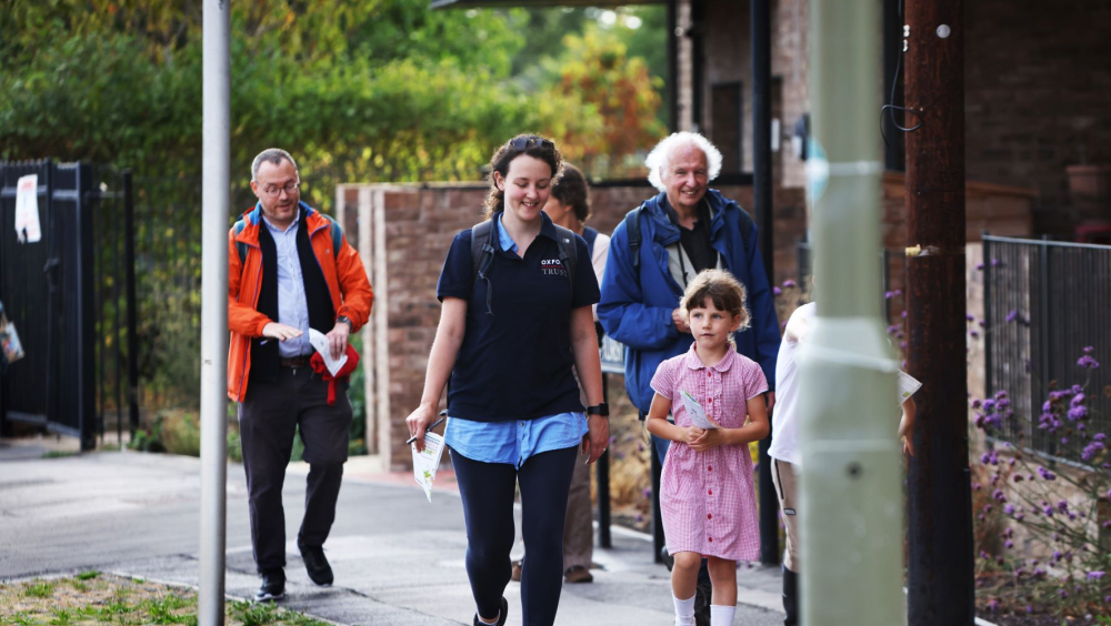 a group of people on a walk on the pavement in Rose Hill