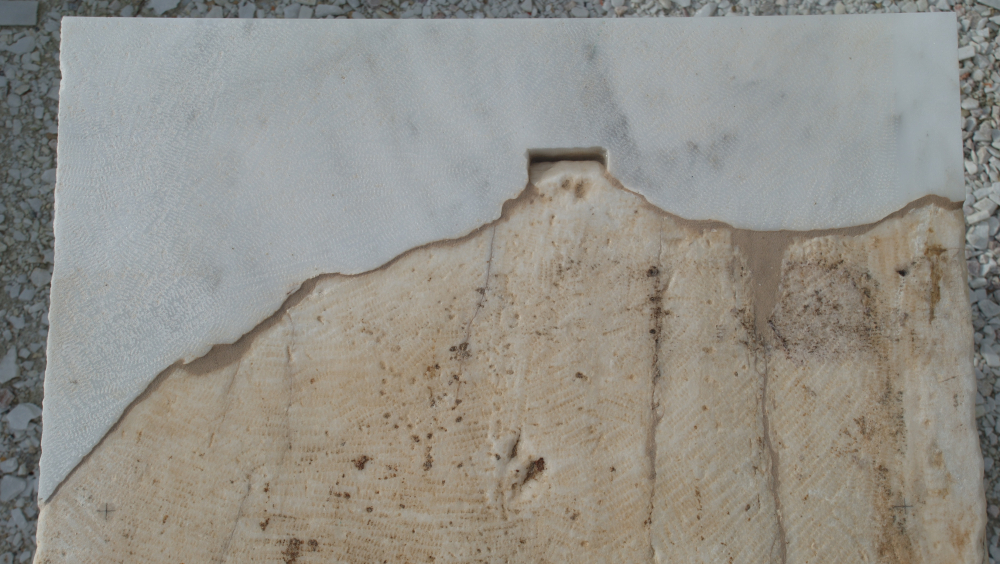 An architectural member supplemented with new marble.