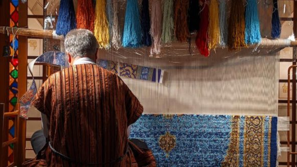 Young person weaving carpets in Icherisheher