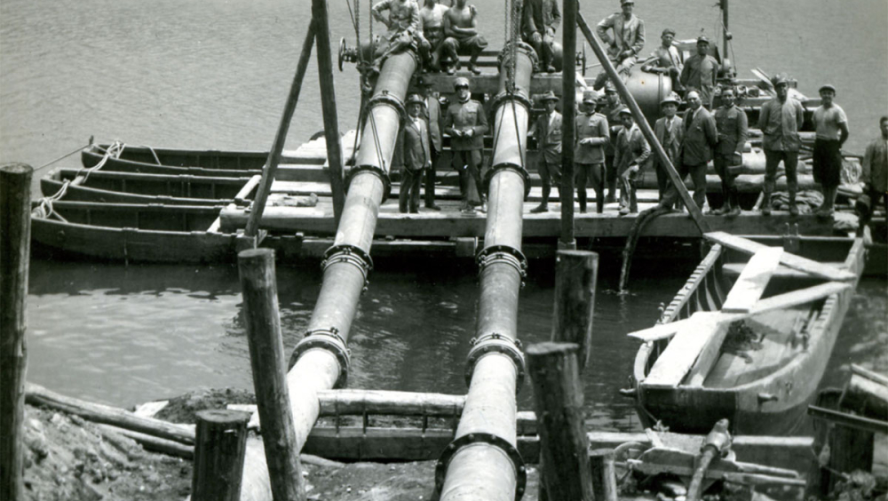 Water pumps draining water from the lake during the recovery of the ships