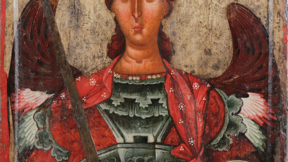 The Archangel Michael, This is one of the most valuable works of the museum collections. It’s origin is from the Church of St. Mary in Mborje, Korçë. The author is anonymous and belongs to the 14th century.  The Archangel Michael, the protector of the Byzantine Churches, is one of the highest quality artistic works. Painted on a wooden panel, he is shown wearing a combat armor and red imperial tunic, as commander-in-chief of the celestial army.