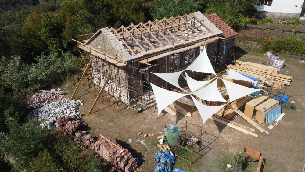 Drone view of the Frasta School during the participatory restoration of the timber roof under the framework of Tsiati Project