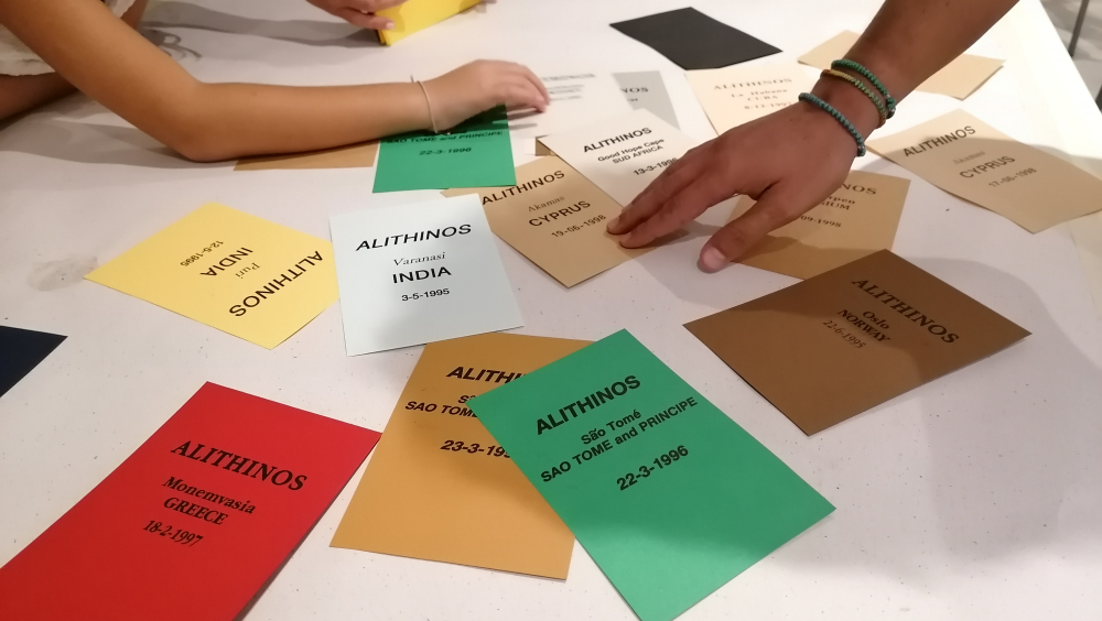 Participants of the workshop "Art in Contemporary Neighborhoods" are touching the cards that Dimitris Alitheinos sends after a new Concealment.