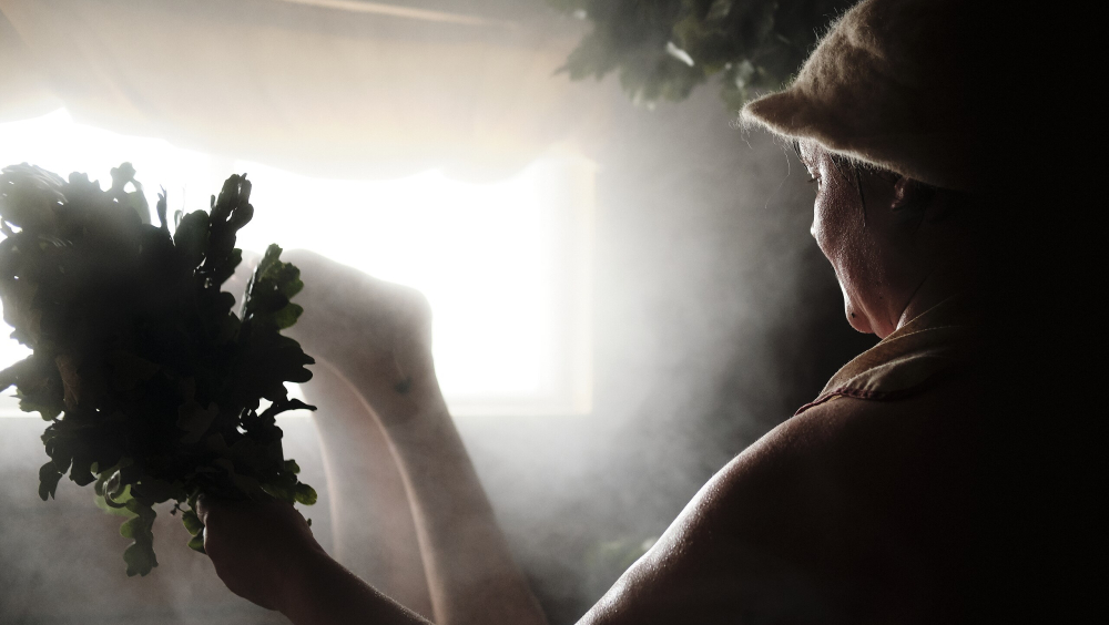 Traditional Finnish sauna whisking by a professional sauna healer Kaisu Mokkila by Ville Kurki.