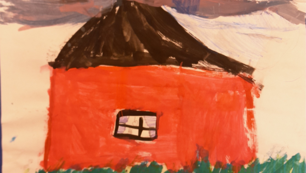 A child's drawing of a red house