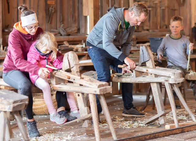 Tag des Denkmals being celebrated in Austria in 2022 - adults and children in a carpentry workshop