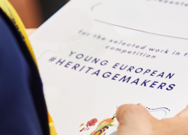 Young European Heritage Makers recognition certificate holding in hand 