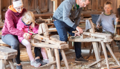 Tag des Denkmals being celebrated in Austria in 2022 - adults and children in a carpentry workshop