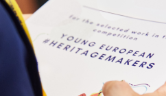 Young European Heritage Makers recognition certificate holding in hand 