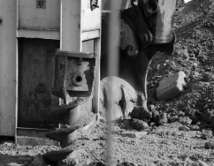 It is a black and white image of a digger, because all is in a process of construction.