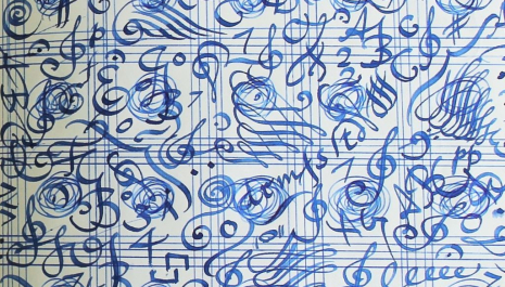 Swirling blue musical notation creates an artistic image