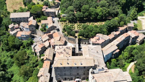 Aerial view of the Villa Giustiniani at Bassano romano and its park. The Giustiniani renovated an old noble palace by adding a garden and a hunting ground: while the palace overlooks the public square of the city, behind it lies the garden and hunting ground.